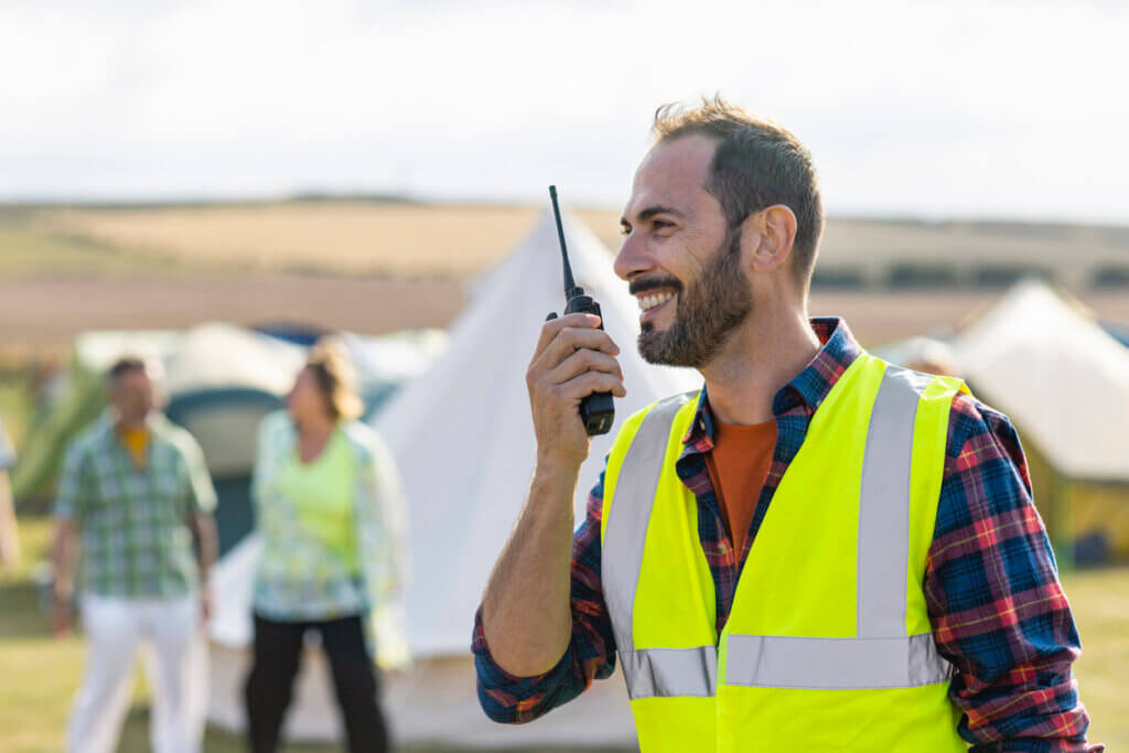 worker with radio at festival